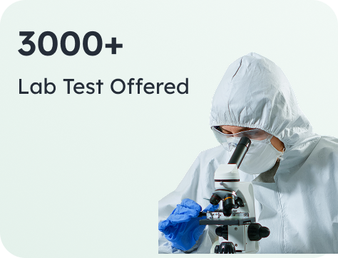 A lab scientist examining a sample under a microscope